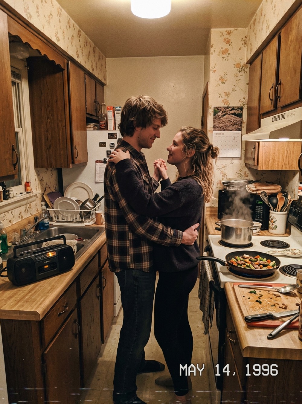 A couple dancing in a small kitchen